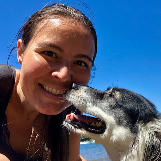 Allyson Gambardella pictured with her companion animal Meeko, head to head, both smiling