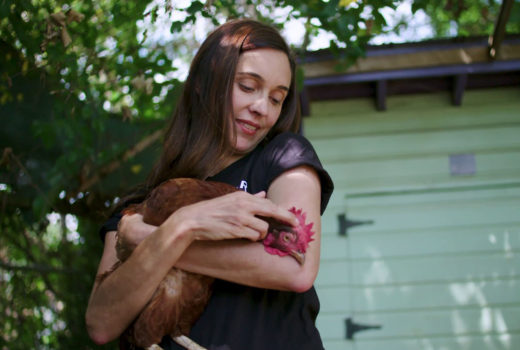 Leah Garces holding a hen