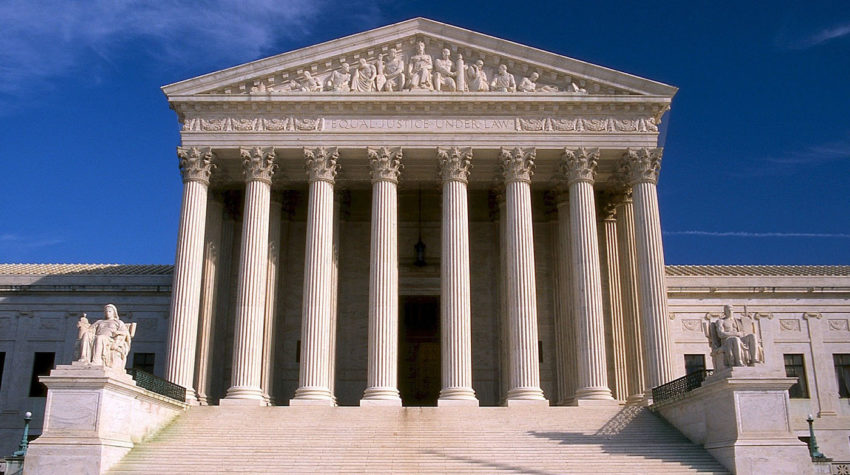 Front of the Supreme Court in front of blue sky